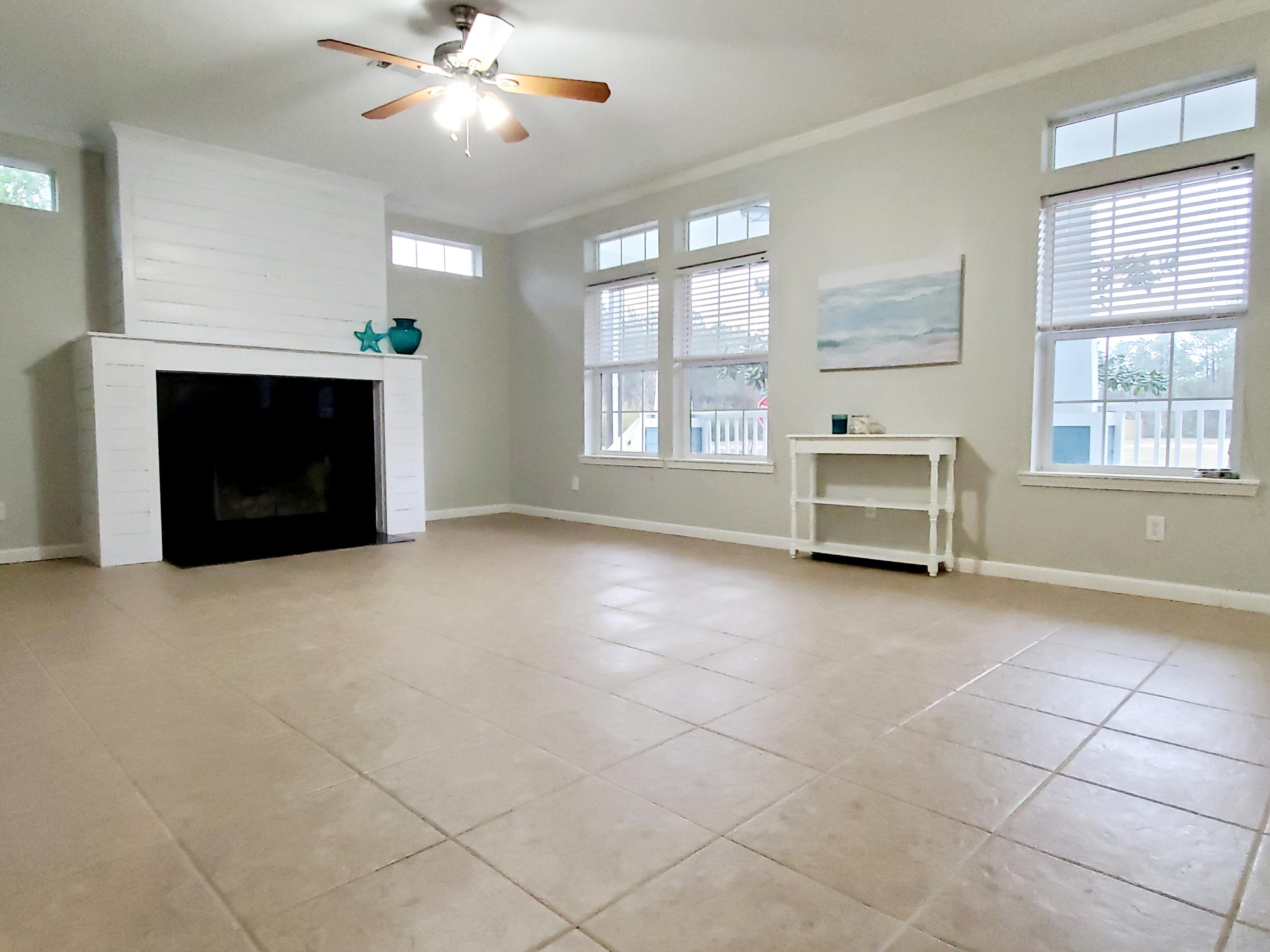 456 East Nursery Road Santa Rosa Beach, FL 32459 - Photo 7 of 21 a view of livingroom with window fireplace and windows
