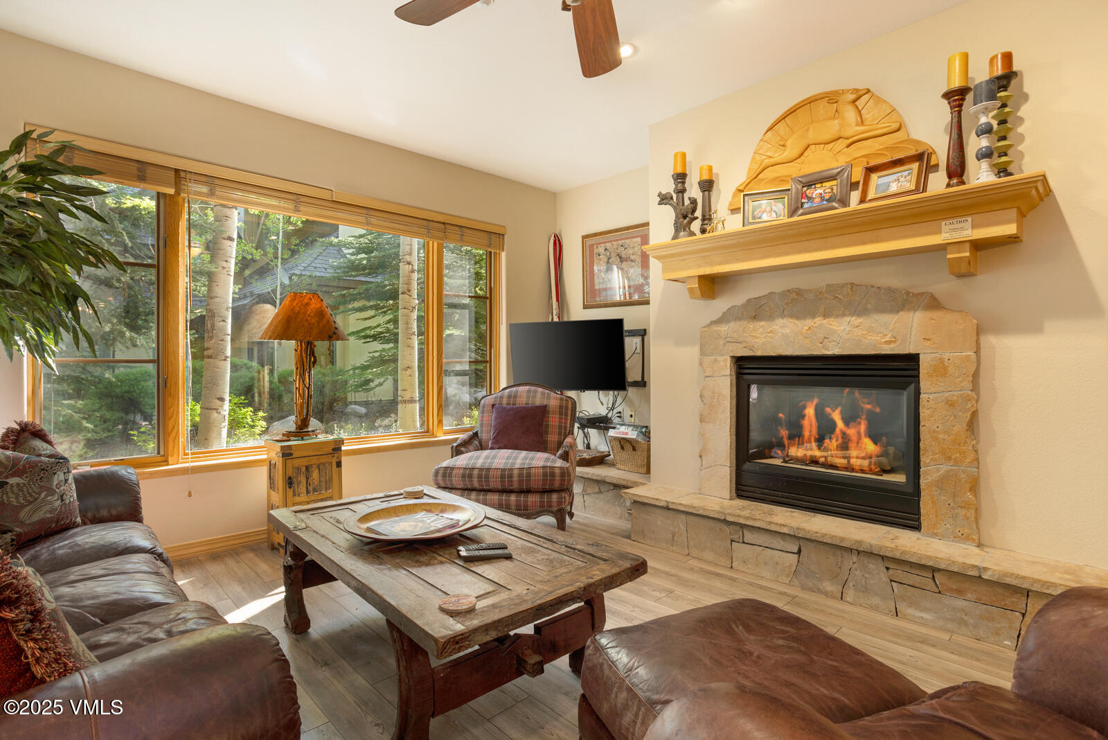 74 Cresta Road, Unit 106 Edwards, CO 81632 - Photo 1 of 22 a living room with furniture a fireplace and a large window with balcony view