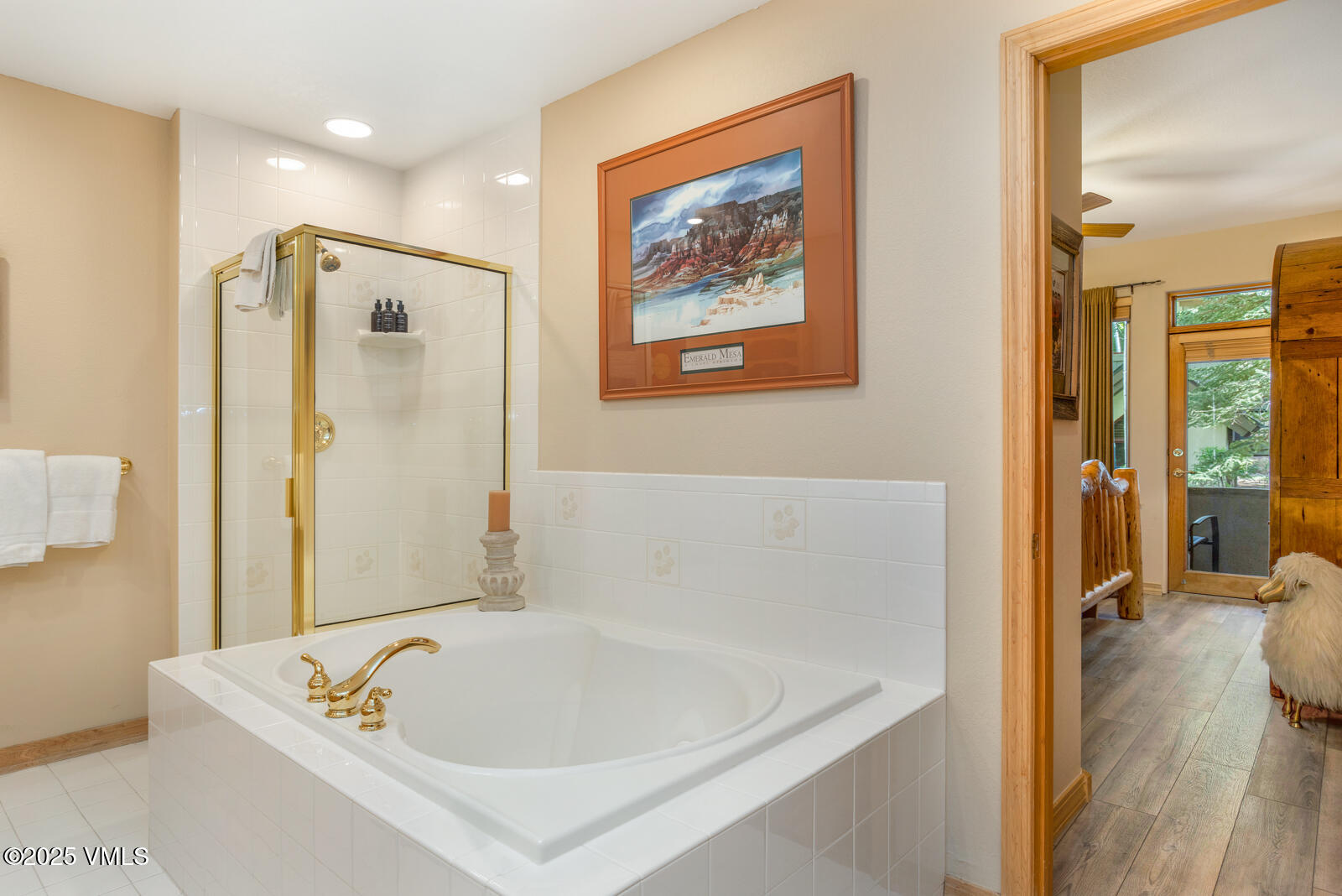 74 Cresta Road, Unit 106 Edwards, CO 81632 - Photo 12 of 22 a white bath tub sitting next to a bathroom
