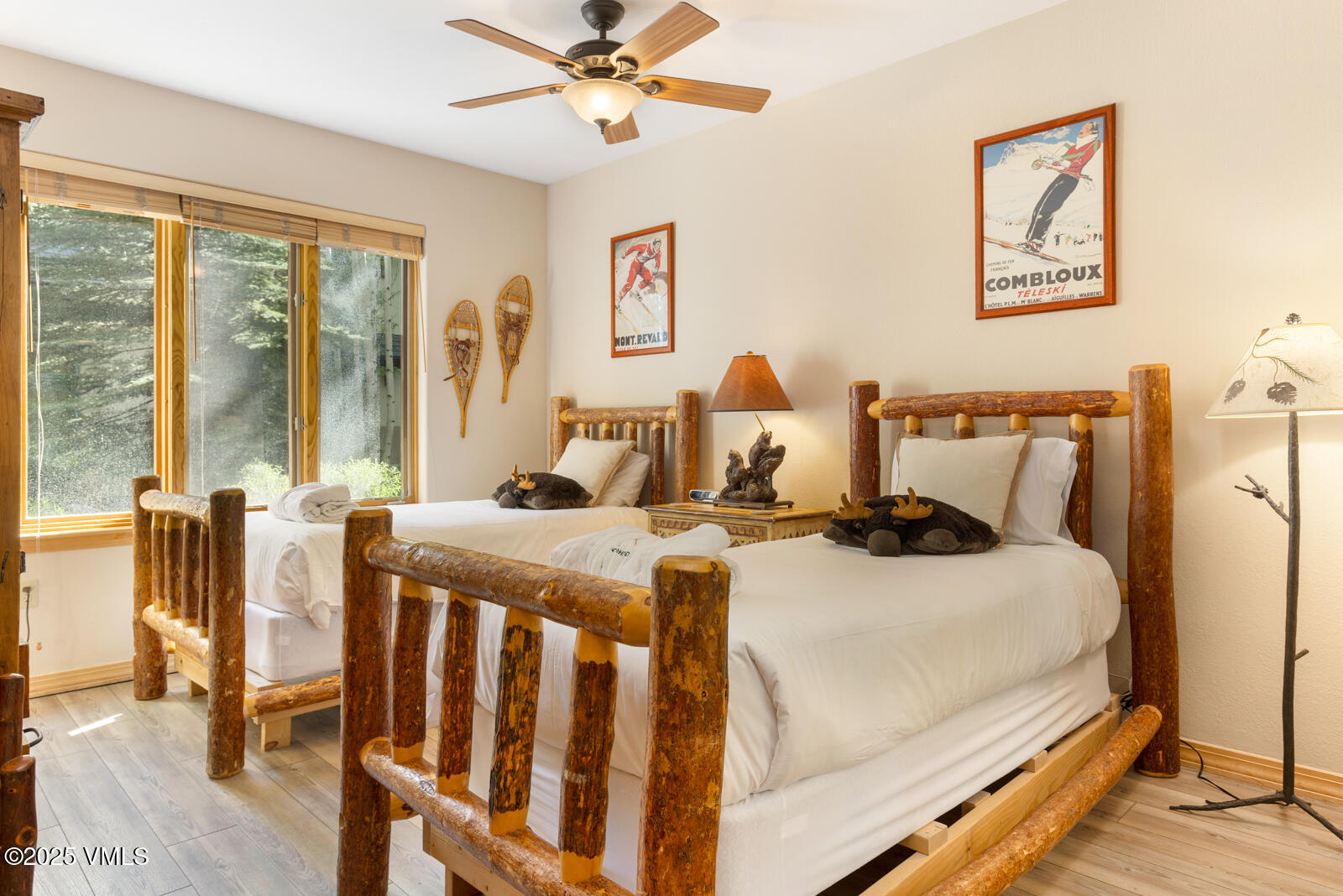 74 Cresta Road, Unit 106 Edwards, CO 81632 - Photo 13 of 22 a bedroom with a bed and a chandelier