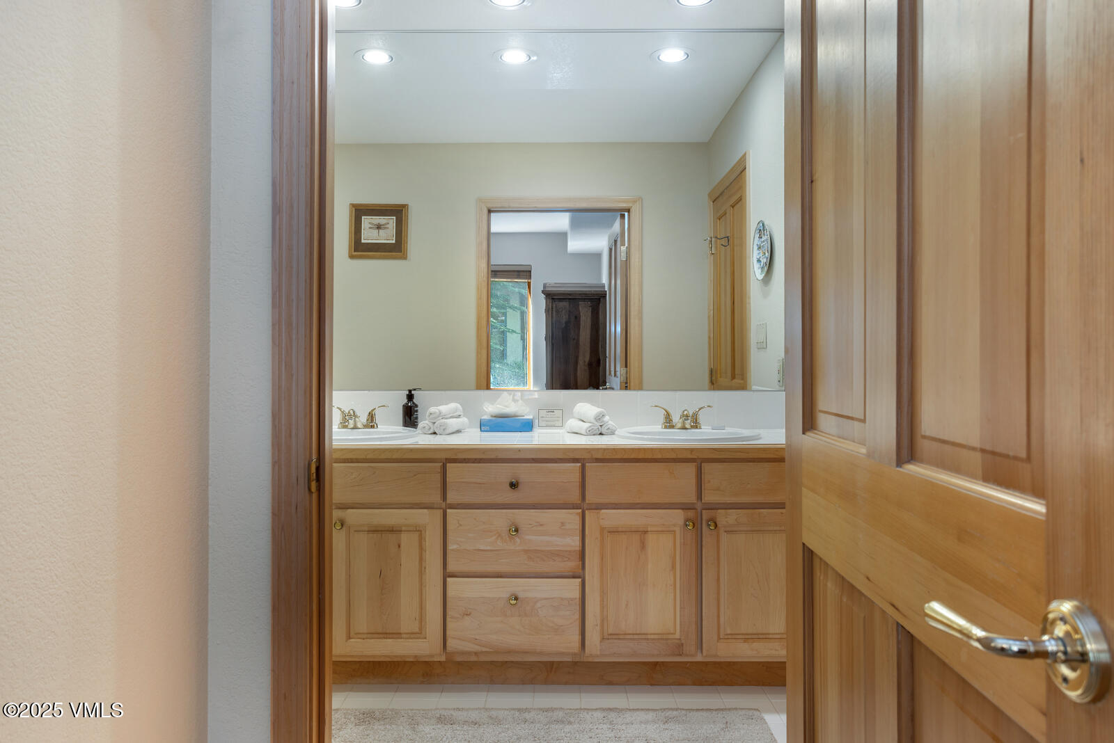 74 Cresta Road, Unit 106 Edwards, CO 81632 - Photo 16 of 22 a bathroom with a double vanity sink and a mirror
