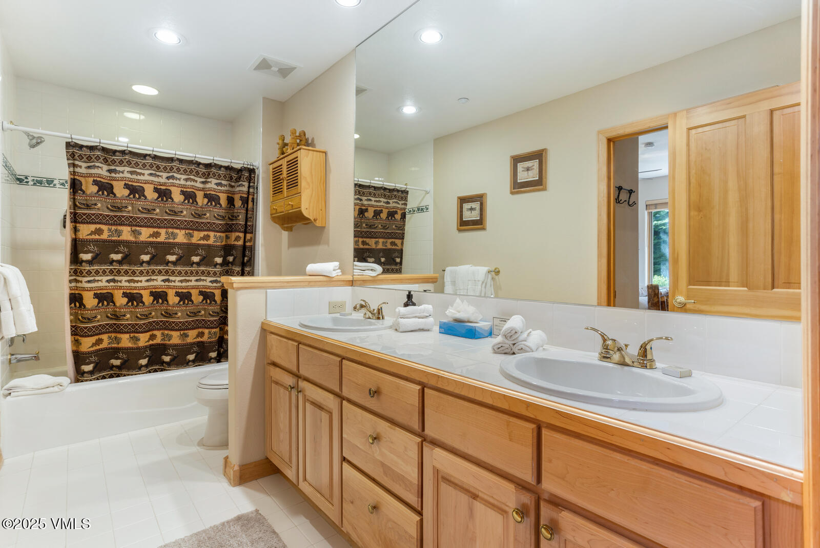74 Cresta Road, Unit 106 Edwards, CO 81632 - Photo 17 of 22 a bathroom with a double vanity sink mirror and double