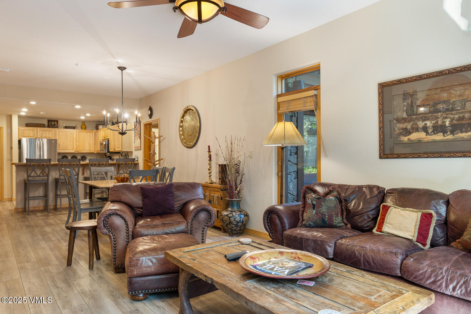74 Cresta Road, Unit 106 Edwards, CO 81632 - Photo 3 of 22 a living room with furniture a rug and wall paintings
