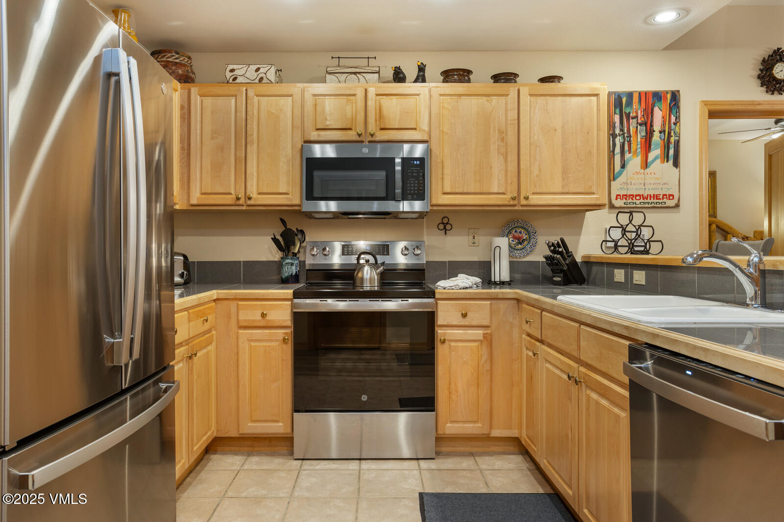 74 Cresta Road, Unit 106 Edwards, CO 81632 - Photo 4 of 22 a kitchen with a sink a refrigerator and a stove top oven