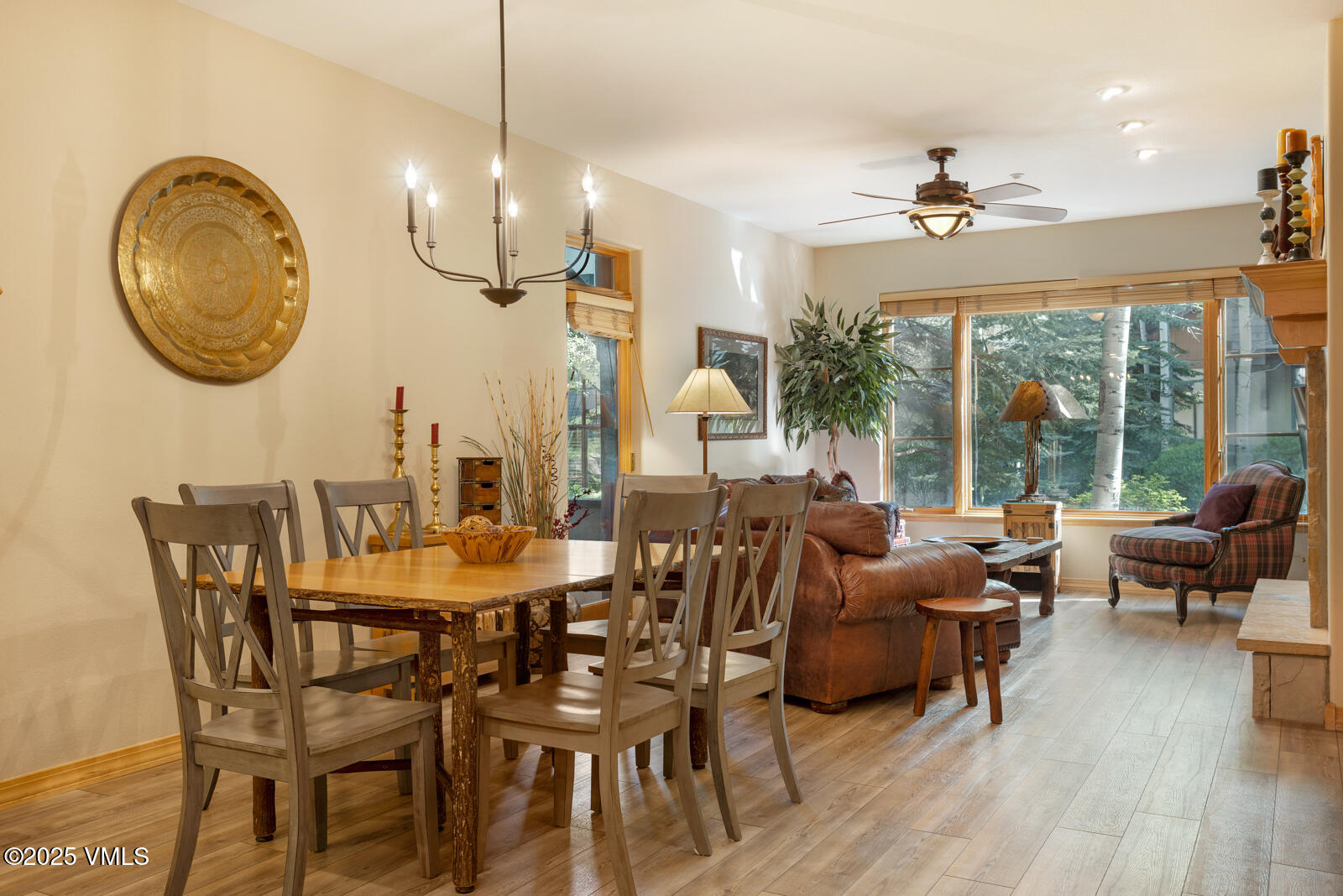 74 Cresta Road, Unit 106 Edwards, CO 81632 - Photo 7 of 22 a dining room with furniture a chandelier and wooden floor