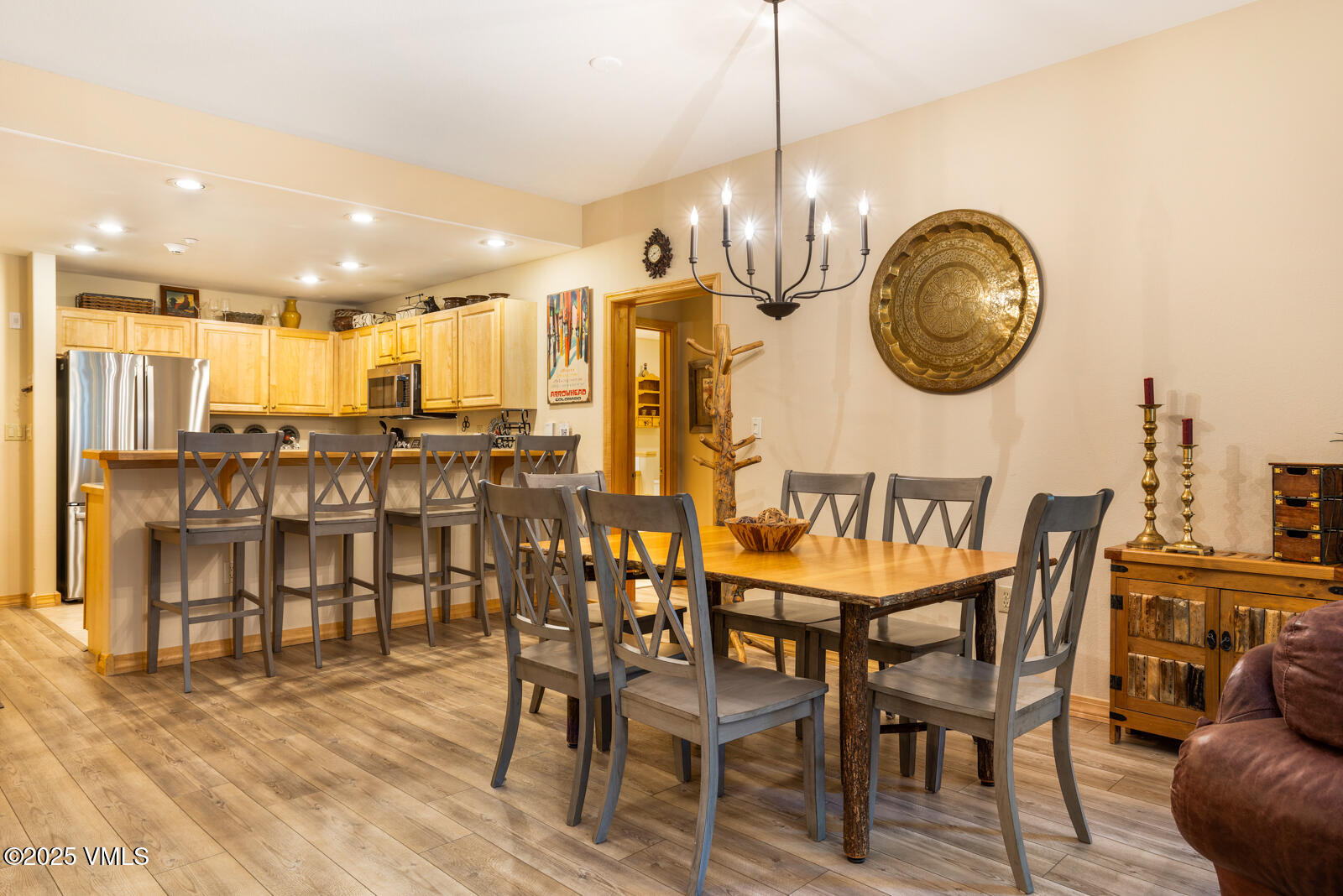 74 Cresta Road, Unit 106 Edwards, CO 81632 - Photo 8 of 22 a view of a dining room with furniture and chandelier