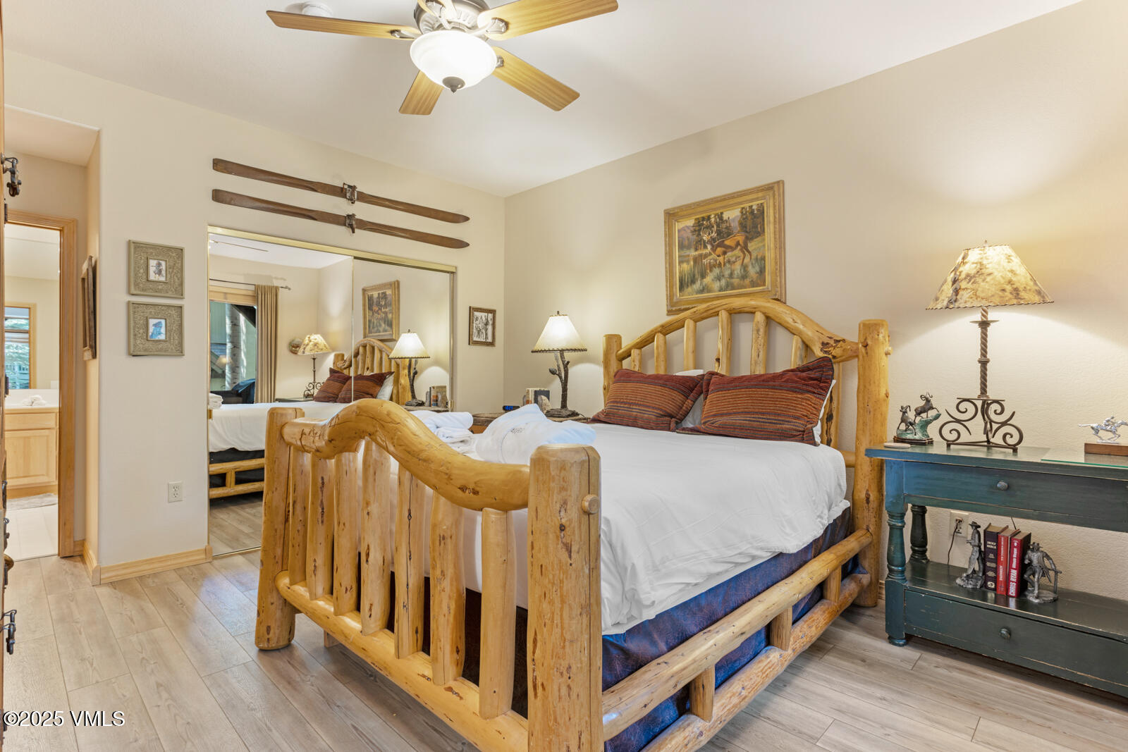 74 Cresta Road, Unit 106 Edwards, CO 81632 - Photo 10 of 22 a bedroom with a bed and wooden floor