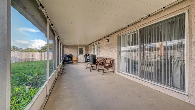 a view of a building with porch and outdoor space