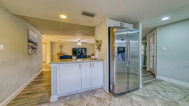 a bathroom with a shower and a sink