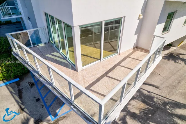 a view of balcony and wooden floor