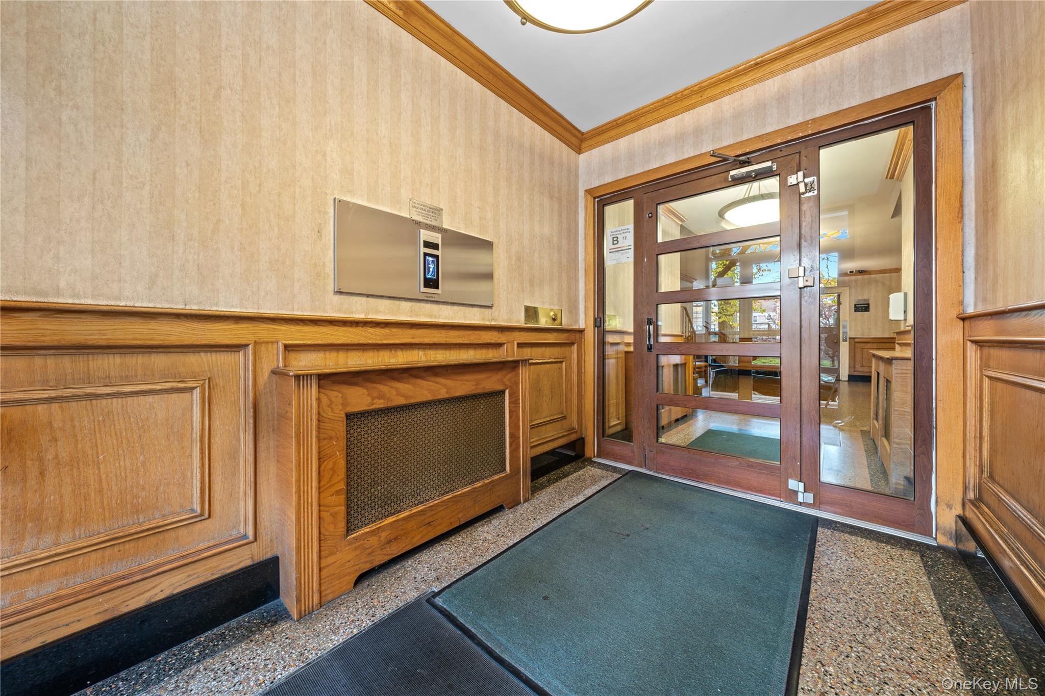 140-18 Burden Crescent, Unit 305 Queens, NY 11435 - Photo 2 of 15 a kitchen with stainless steel appliances granite countertop a stove and a refrigerator
