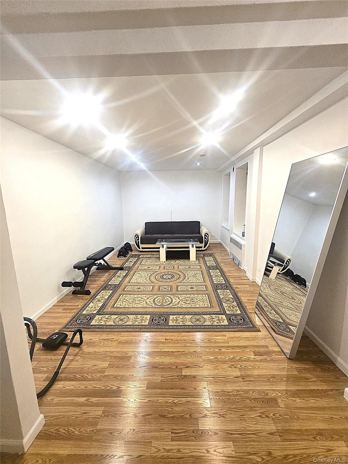 140-18 Burden Crescent, Unit 305 Queens, NY 11435 - Photo 7 of 15 a view of a room with gym equipment