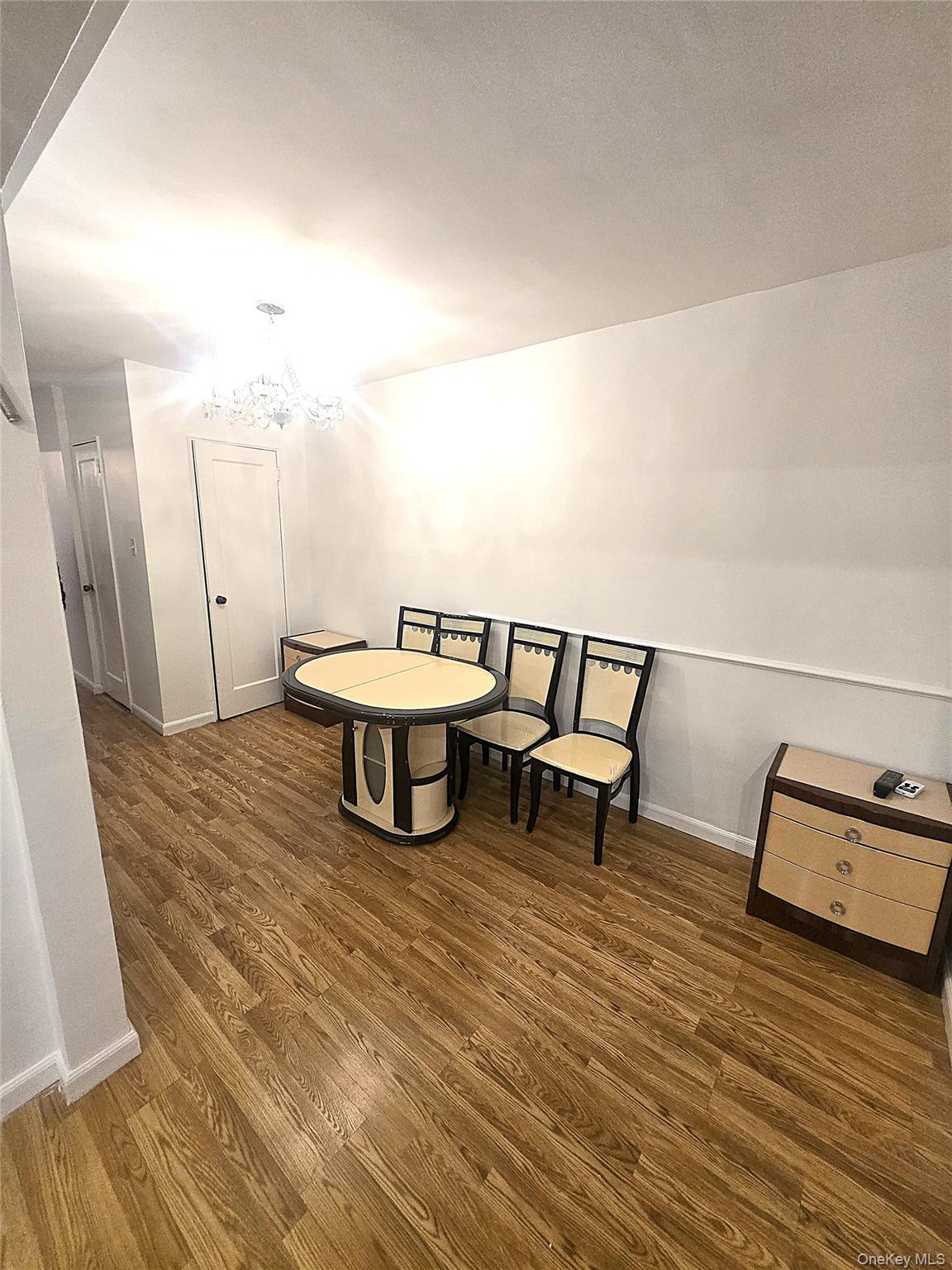 140-18 Burden Crescent, Unit 305 Queens, NY 11435 - Photo 8 of 15 a living room with furniture