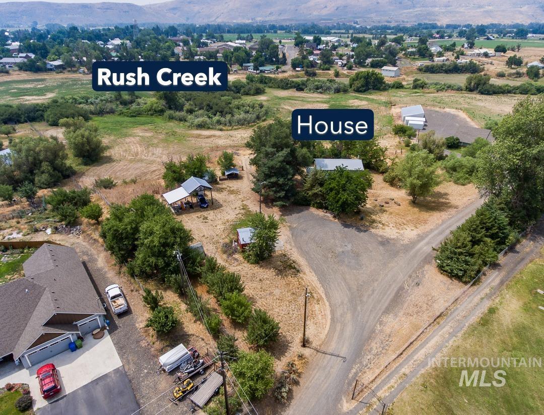 595 Cemetery Road Cambridge, ID 83610 - Photo 38 of 47 Aerial property perspective showcasing a main residence, secondary structures, and extensive land