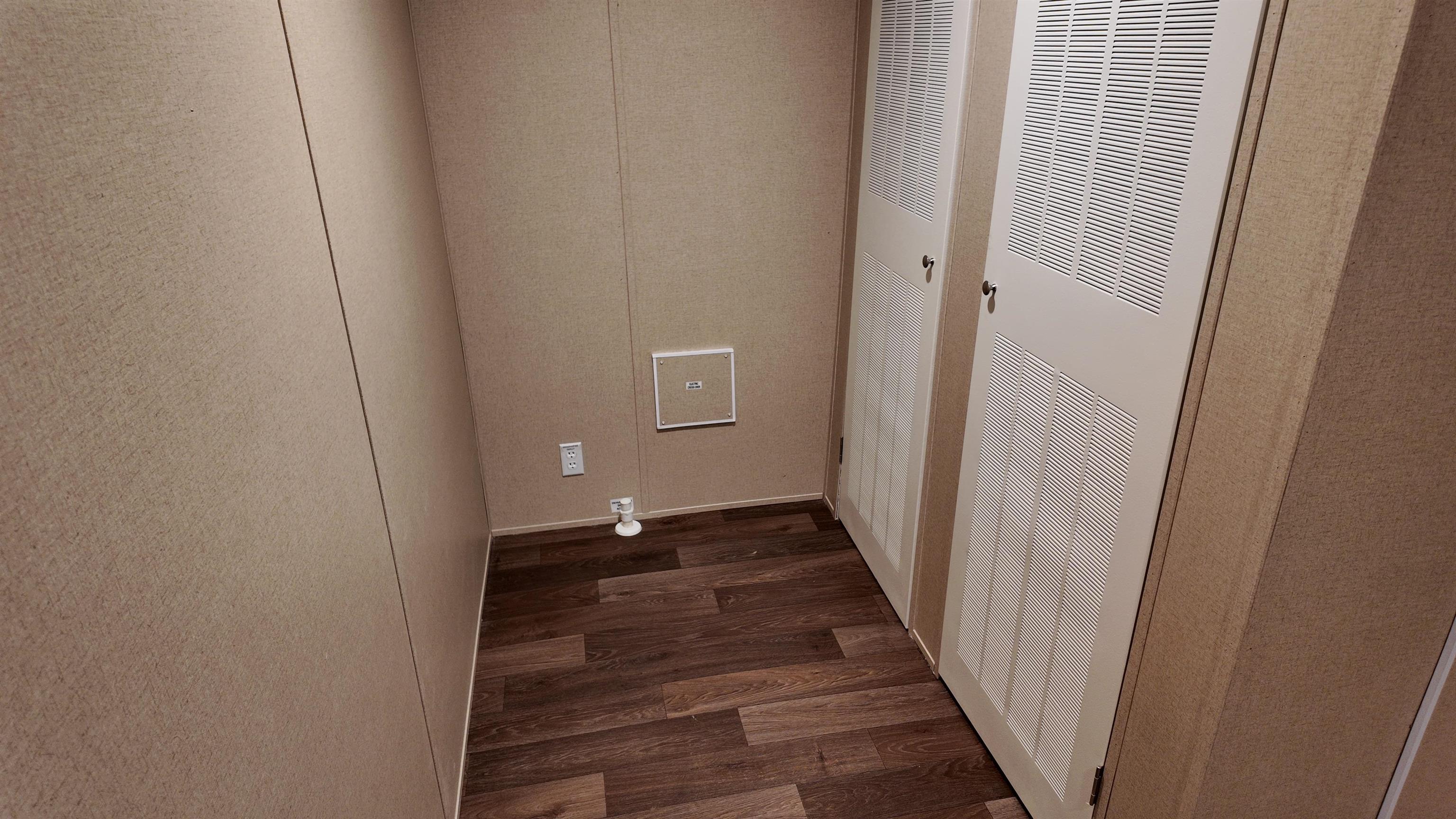 208 Marcy Cove Ripley, TN 38063 - Photo 13 of 14 Washroom featuring wood finished floors and a heating unit