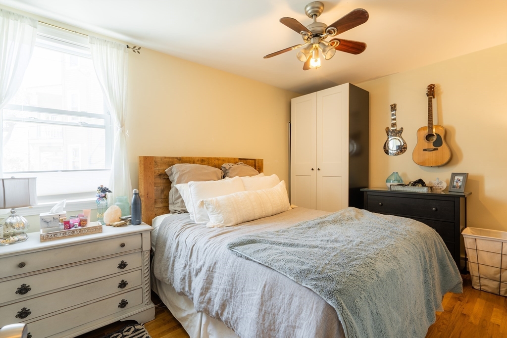 328 Beacon Street, Unit 1F Somerville, MA 02143 - Photo 8 of 10 a bedroom with a bed and a window