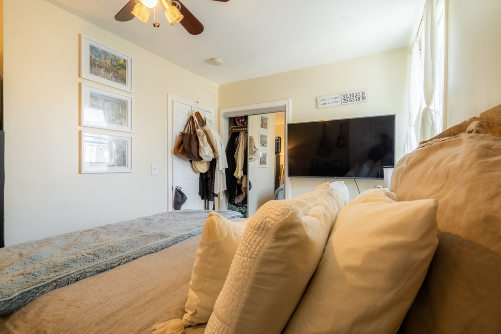 328 Beacon Street, Unit 1F Somerville, MA 02143 - Photo 10 of 10 a living room with furniture and a flat screen tv