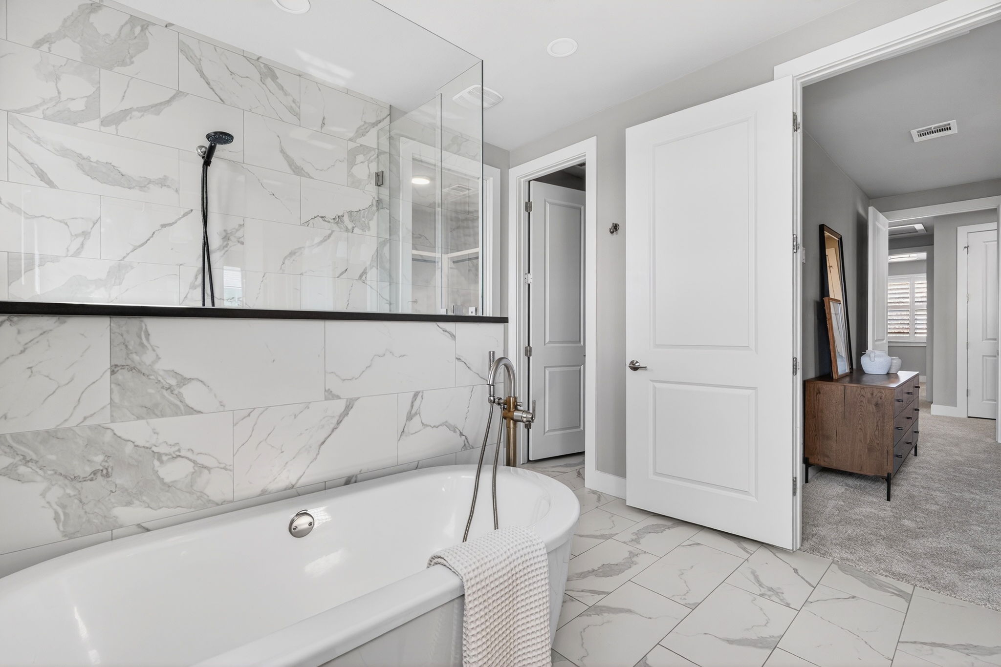 7803 Ryans Way Austin, TX 78726 - Photo 21 of 38 A freestanding soaking tub creates a spa-like focal point.