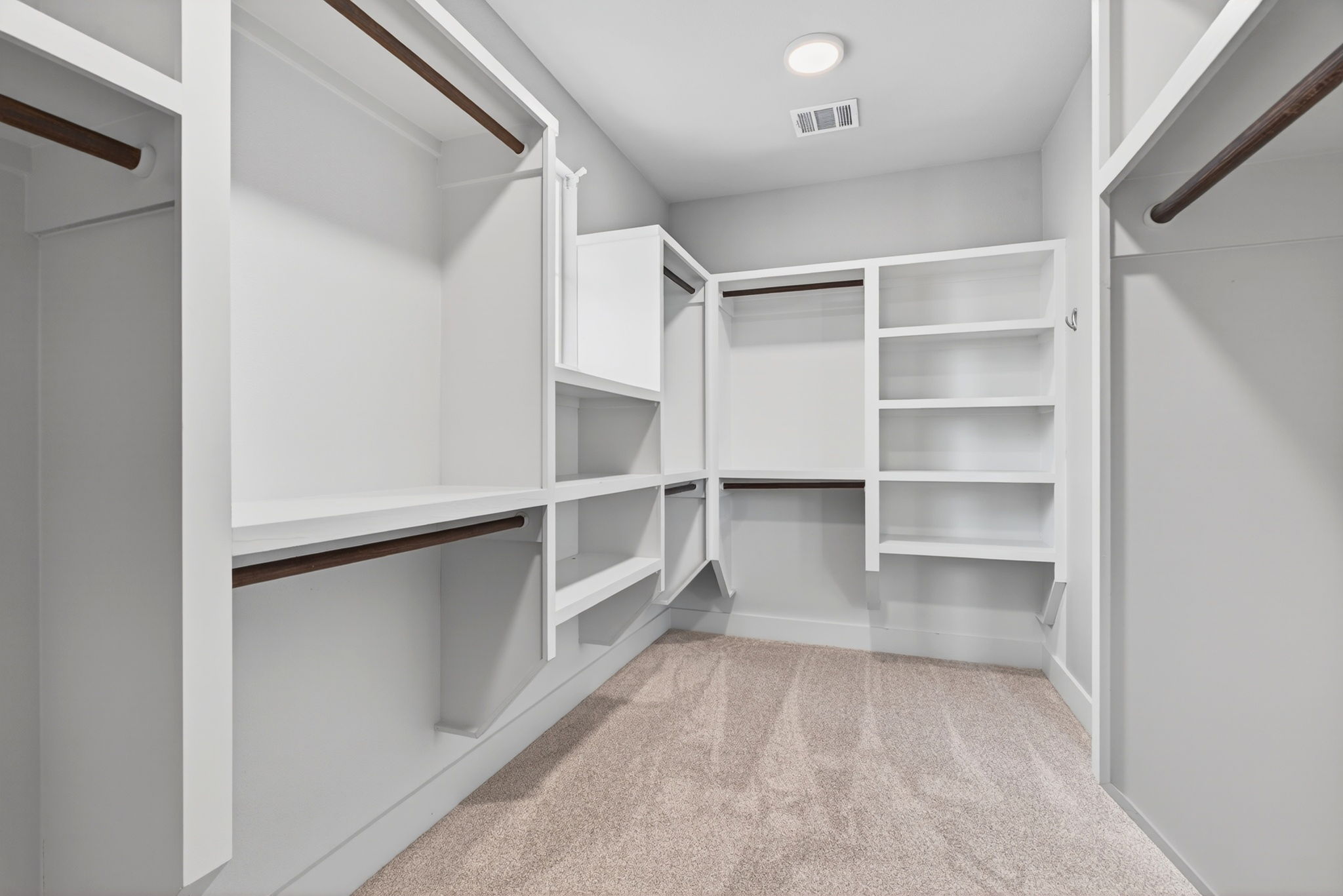 7803 Ryans Way Austin, TX 78726 - Photo 23 of 38 The spacious walk-in primary closet offers generous storage with room for seasonal wardrobes and organized everyday living.