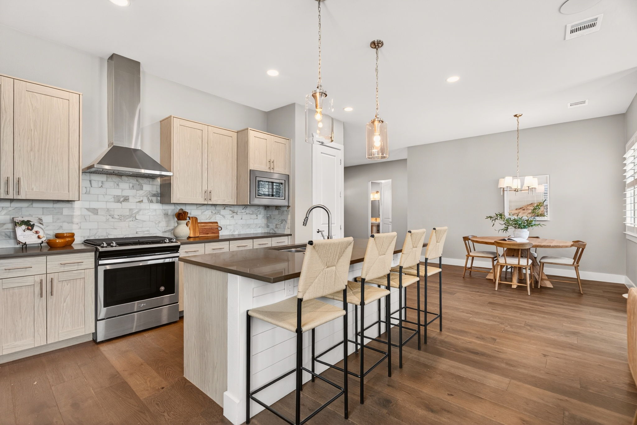 7803 Ryans Way Austin, TX 78726 - Photo 5 of 38 The central kitchen features a large quartz island perfect for gathering.