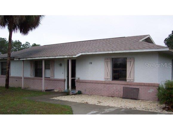 39 Teak Road Ocala, FL 34472 - Photo 1 of 1 a house view with a garden space