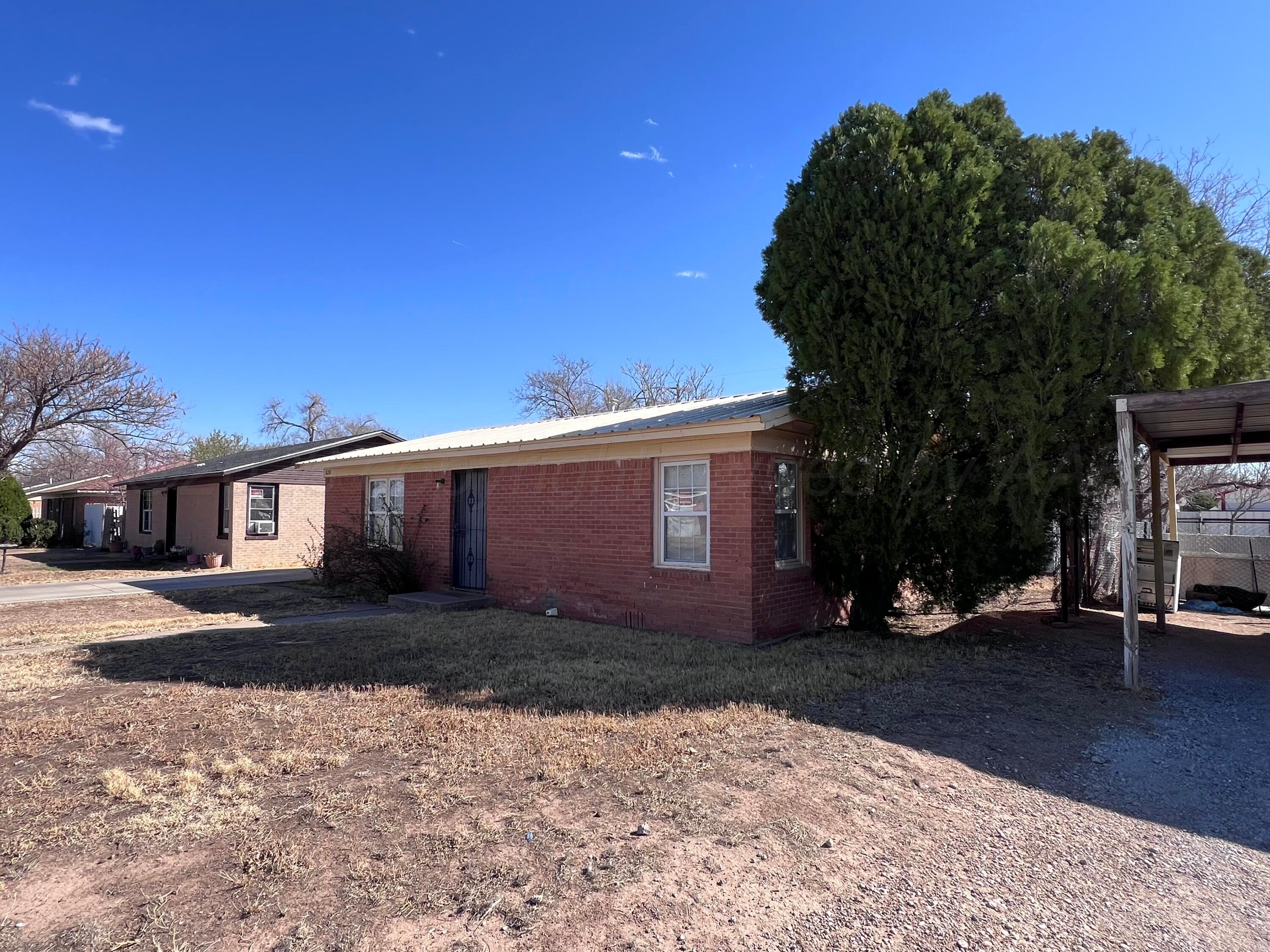 828 Blevins Street Hereford, TX 79045 - Photo 3 of 14 a view of a house with a yard