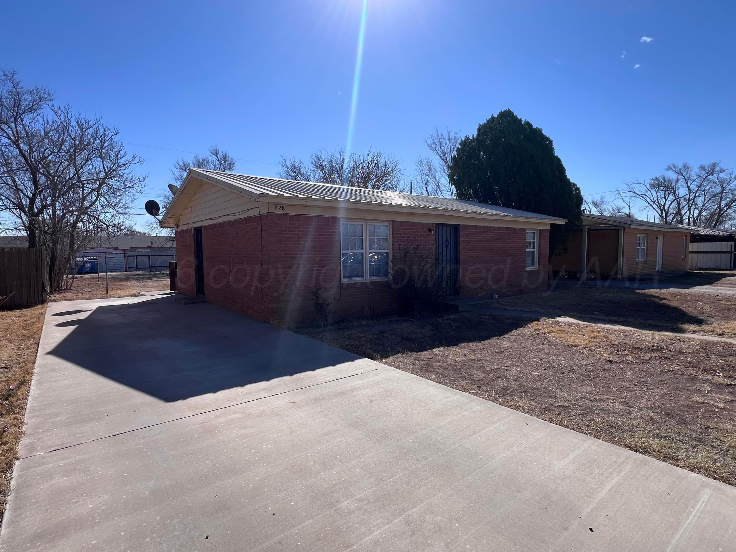 828 Blevins Street Hereford, TX 79045 - Photo 4 of 14 a view of a house with a yard