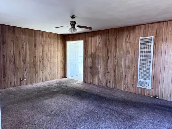 a view of empty room with windows