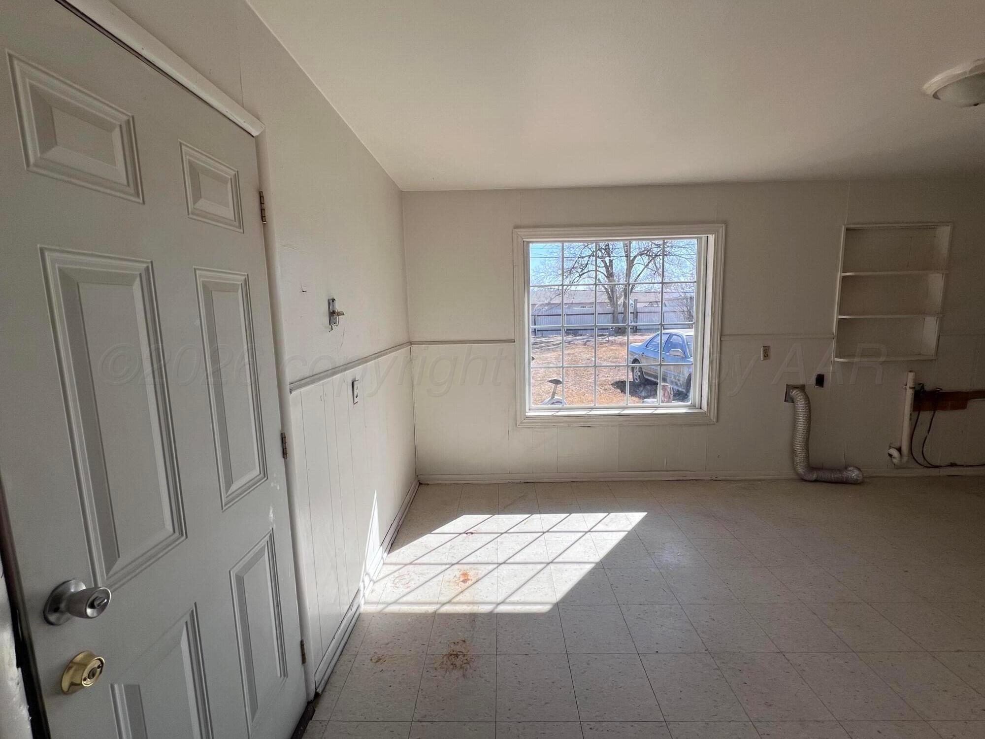 828 Blevins Street Hereford, TX 79045 - Photo 8 of 14 a view of entryway with window