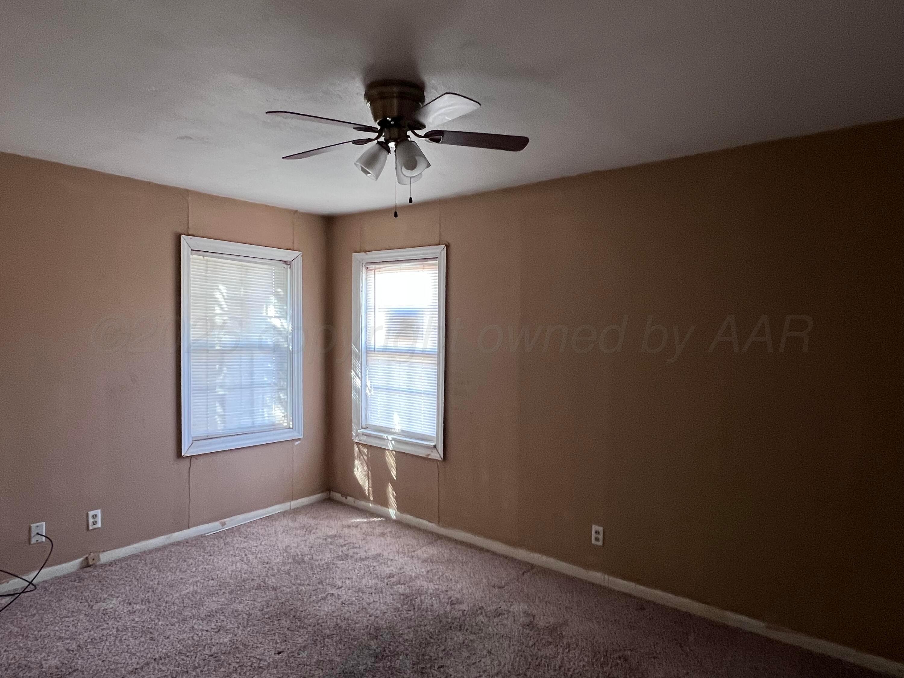 828 Blevins Street Hereford, TX 79045 - Photo 10 of 14 a view of an empty room with a window