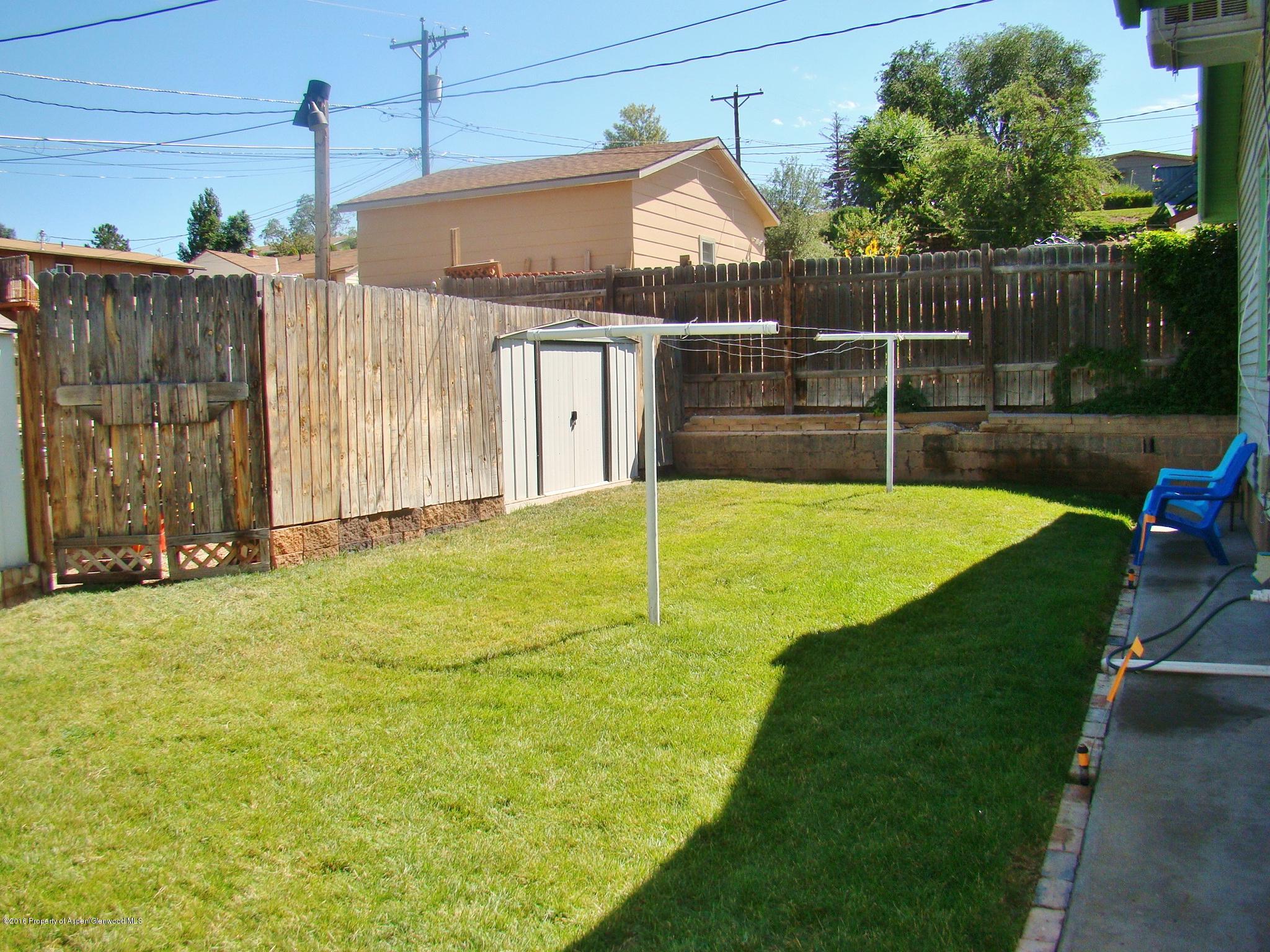 1010 Munro Avenue Rifle, CO 81650 - Photo 22 of 23 a view of a backyard with swimming pool