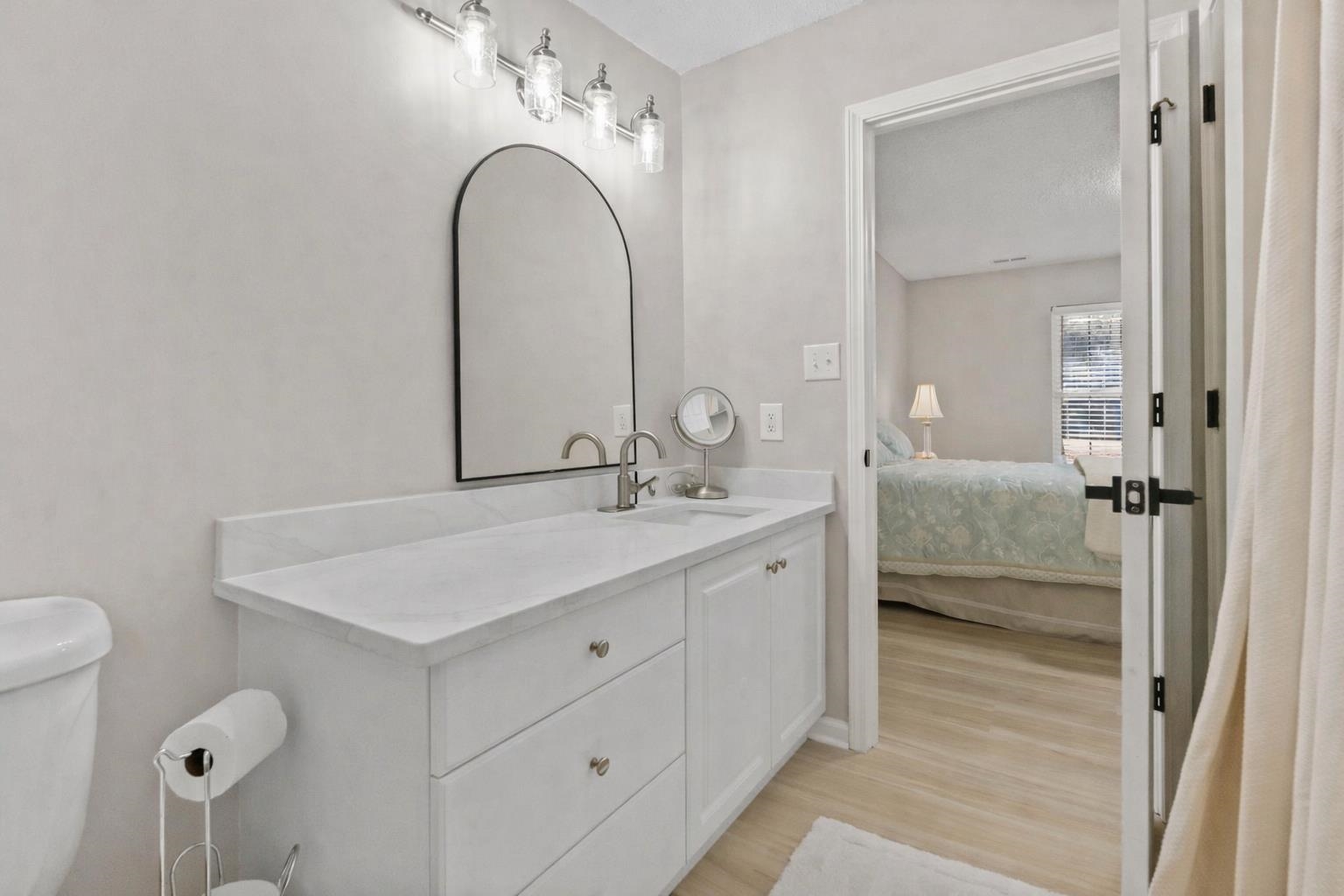 135 Country Manor Drive, Unit B Conway, SC 29526 - Photo 19 of 40 Full bath with vanity, ensuite bath, and light wood-style floors