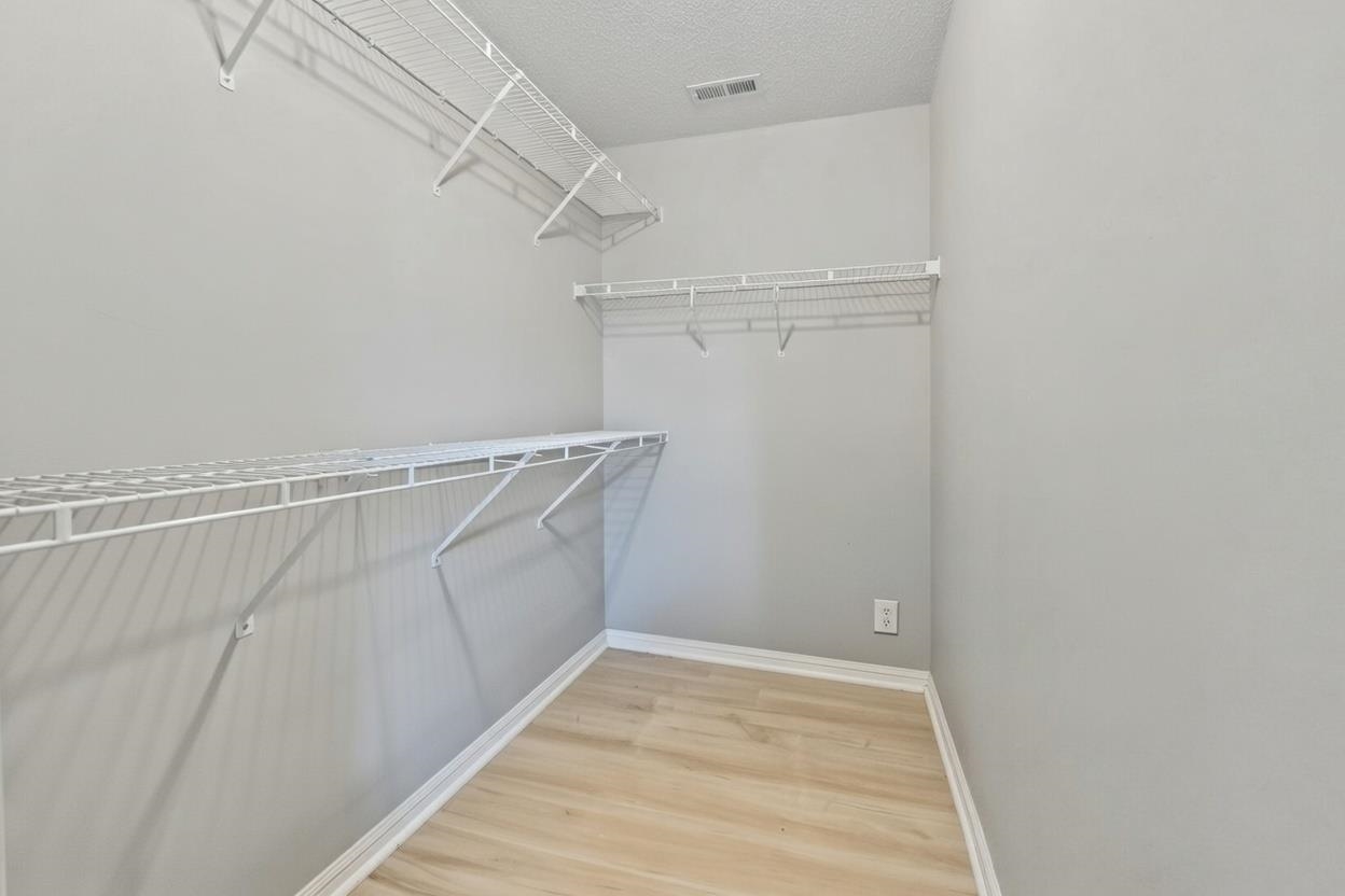 135 Country Manor Drive, Unit B Conway, SC 29526 - Photo 21 of 40 Walk in closet featuring light wood-type flooring