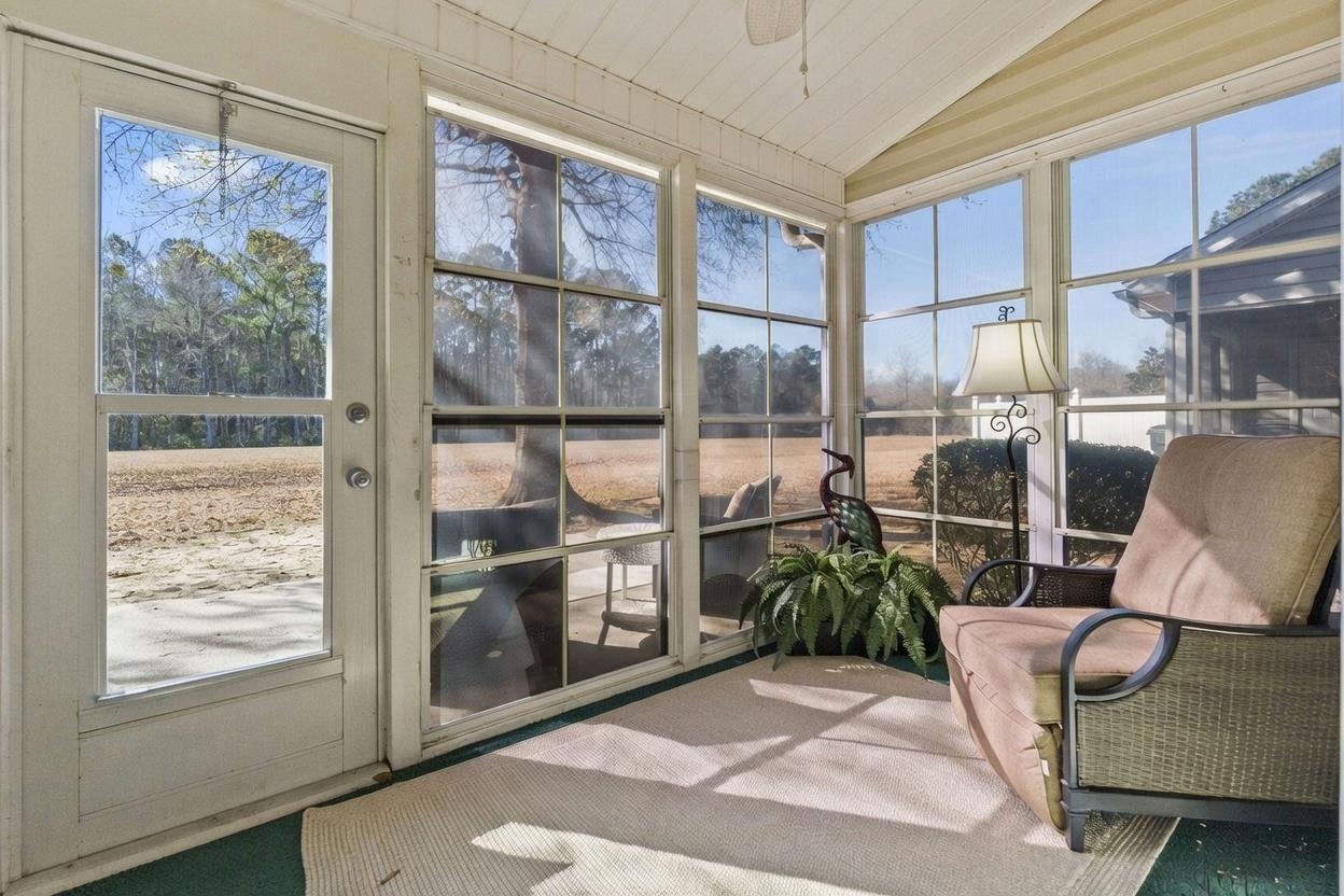 135 Country Manor Drive, Unit B Conway, SC 29526 - Photo 30 of 40 Sunroom with vaulted ceiling and a ceiling fan