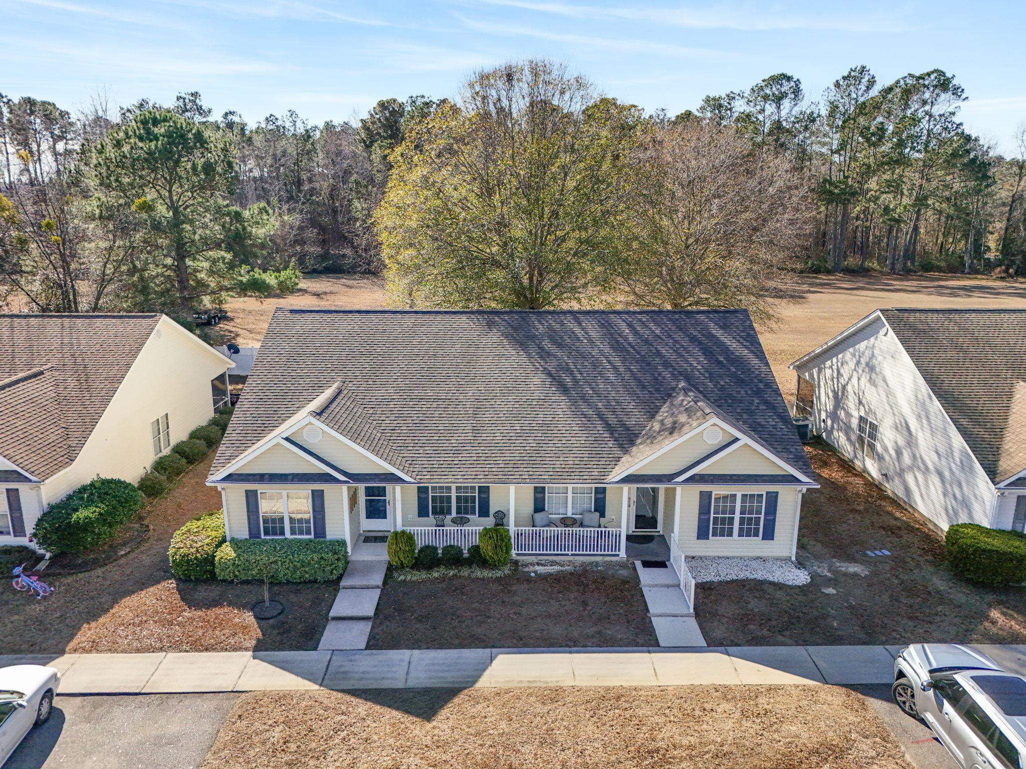 135 Country Manor Drive, Unit B Conway, SC 29526 - Photo 34 of 40 View of front of home with a shingled roof and a porch