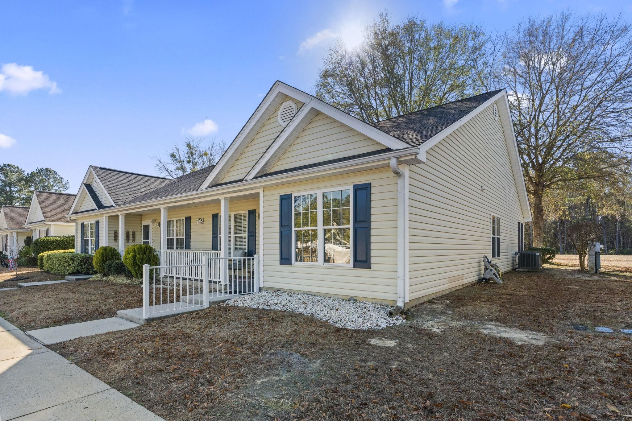 135 Country Manor Drive, Unit B Conway, SC 29526 - Photo 36 of 40 View of front of property featuring a porch and a shingled roof