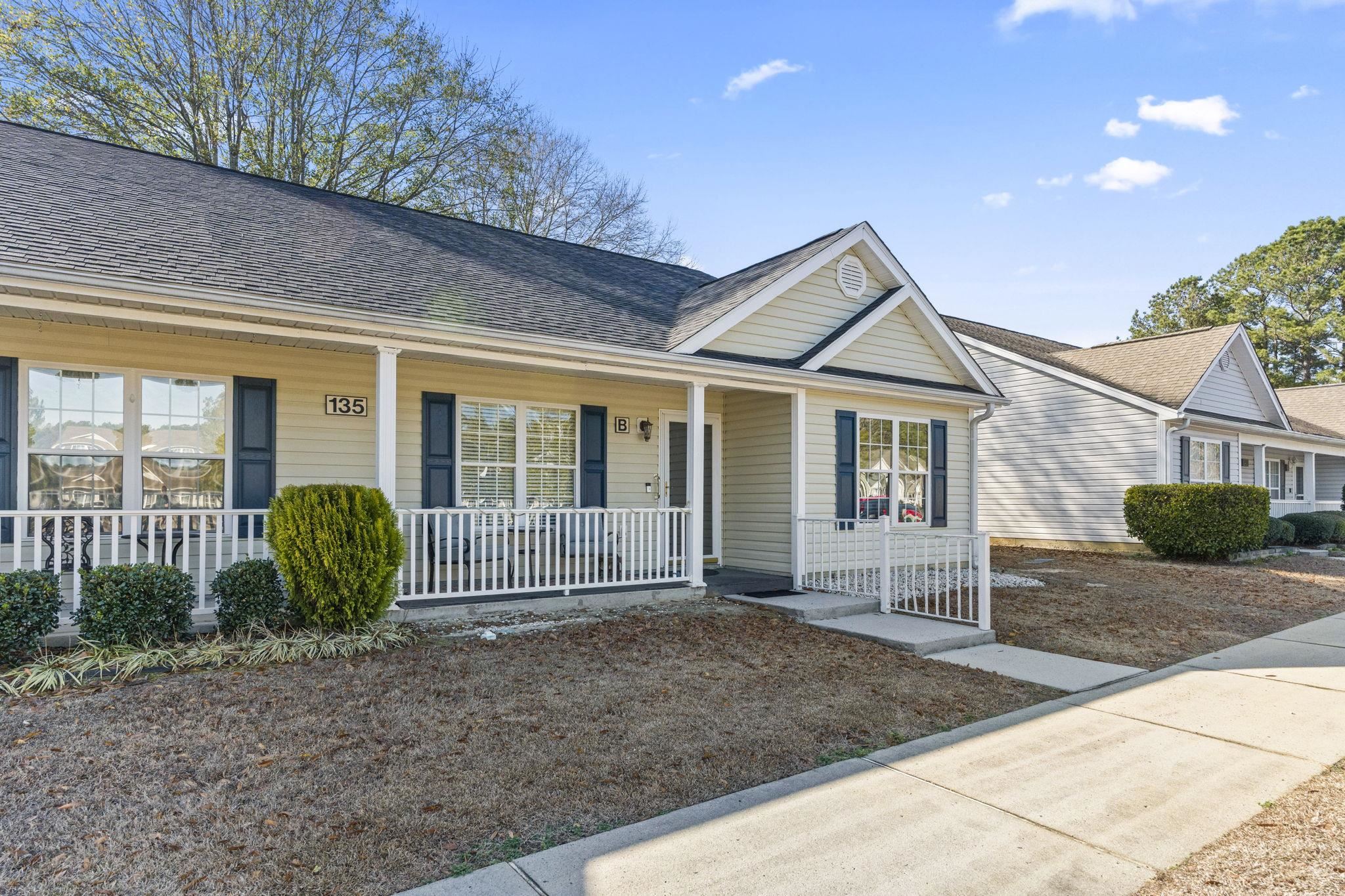 135 Country Manor Drive, Unit B Conway, SC 29526 - Photo 38 of 40 View of front of home with covered porch and roof with shingles
