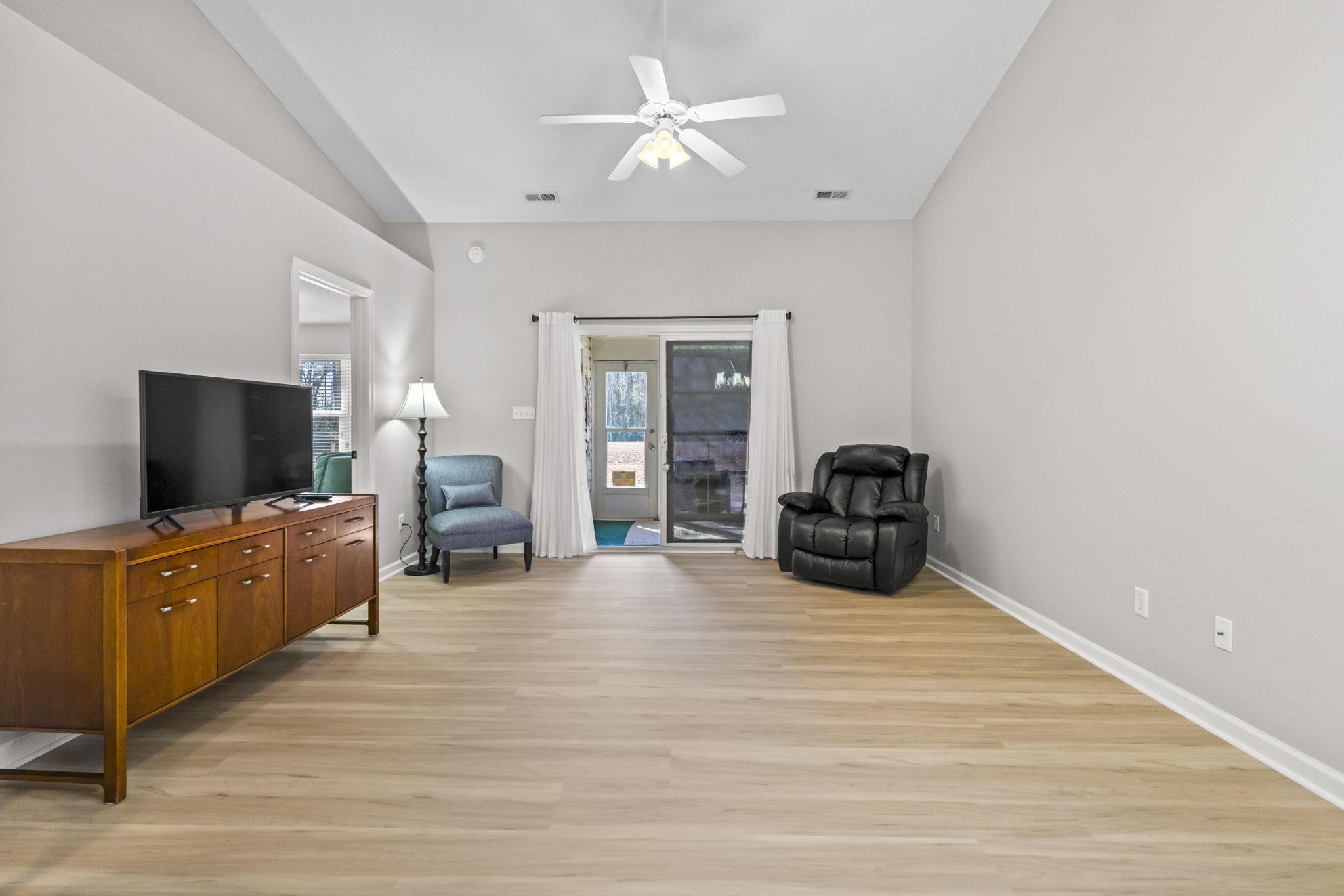 135 Country Manor Drive, Unit B Conway, SC 29526 - Photo 10 of 40 Sitting room featuring ceiling fan, light wood-type flooring, and vaulted ceiling