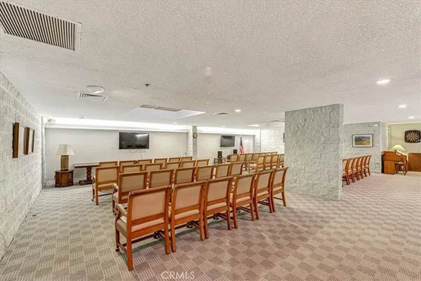 a room with furniture pool table and window