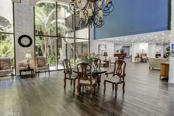 a living room with furniture chandelier and a chandelier