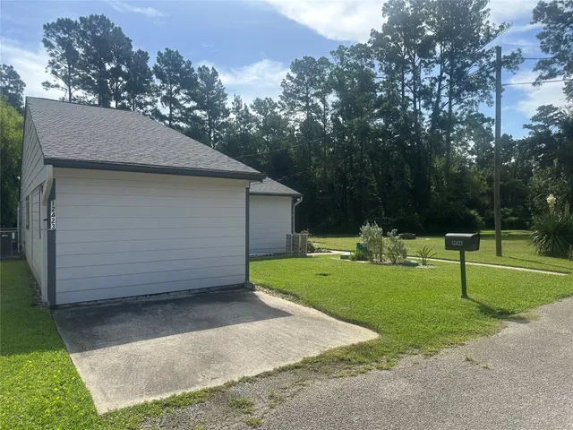 a view of a backyard with green space