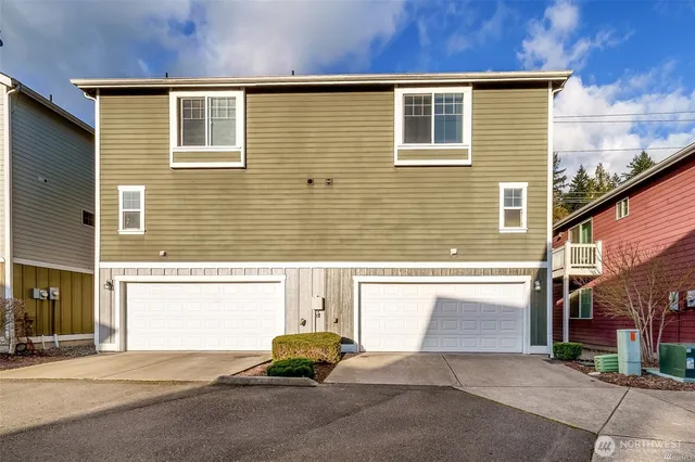 a front view of a house with a garage