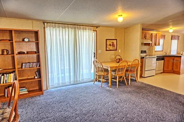 a view of a livingroom with furniture and workspace