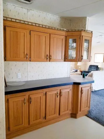 a kitchen with a sink and cabinets