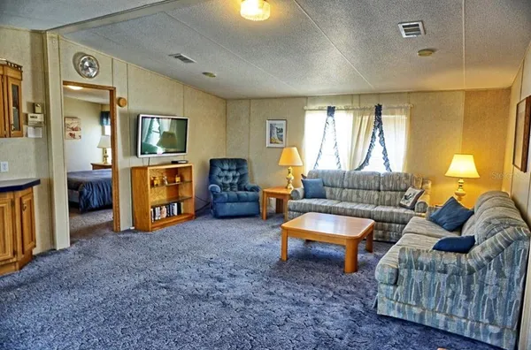 a living room with furniture and a area