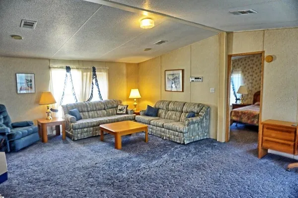 a living room with furniture and a couch