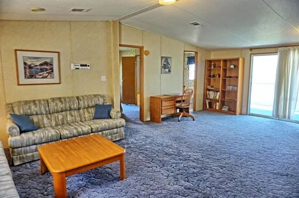 a living room with furniture and a rug