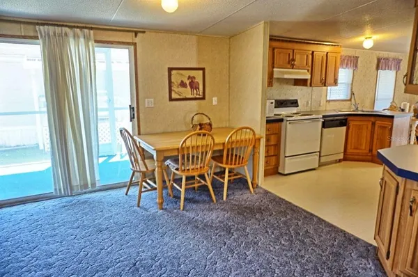 a view of a dining room with furniture and a table