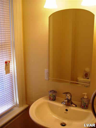 706 East 5th Street Bethlehem, PA 18015 - Photo 4 of 9 a bathroom with a sink and a mirror