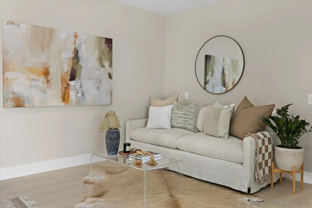 3663 Oleander Drive San Diego, CA 92106 - Photo 24 of 46 a living room with furniture a mirror and a white wall